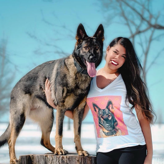 Jade the sable GSD standing on a stump next to her owner who is wearing a Jade t-shirt